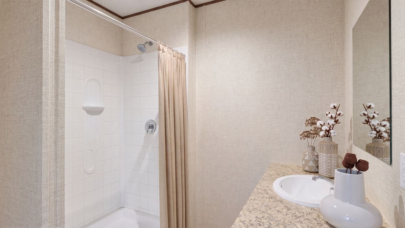 Oak floor plan home, primary bathroom